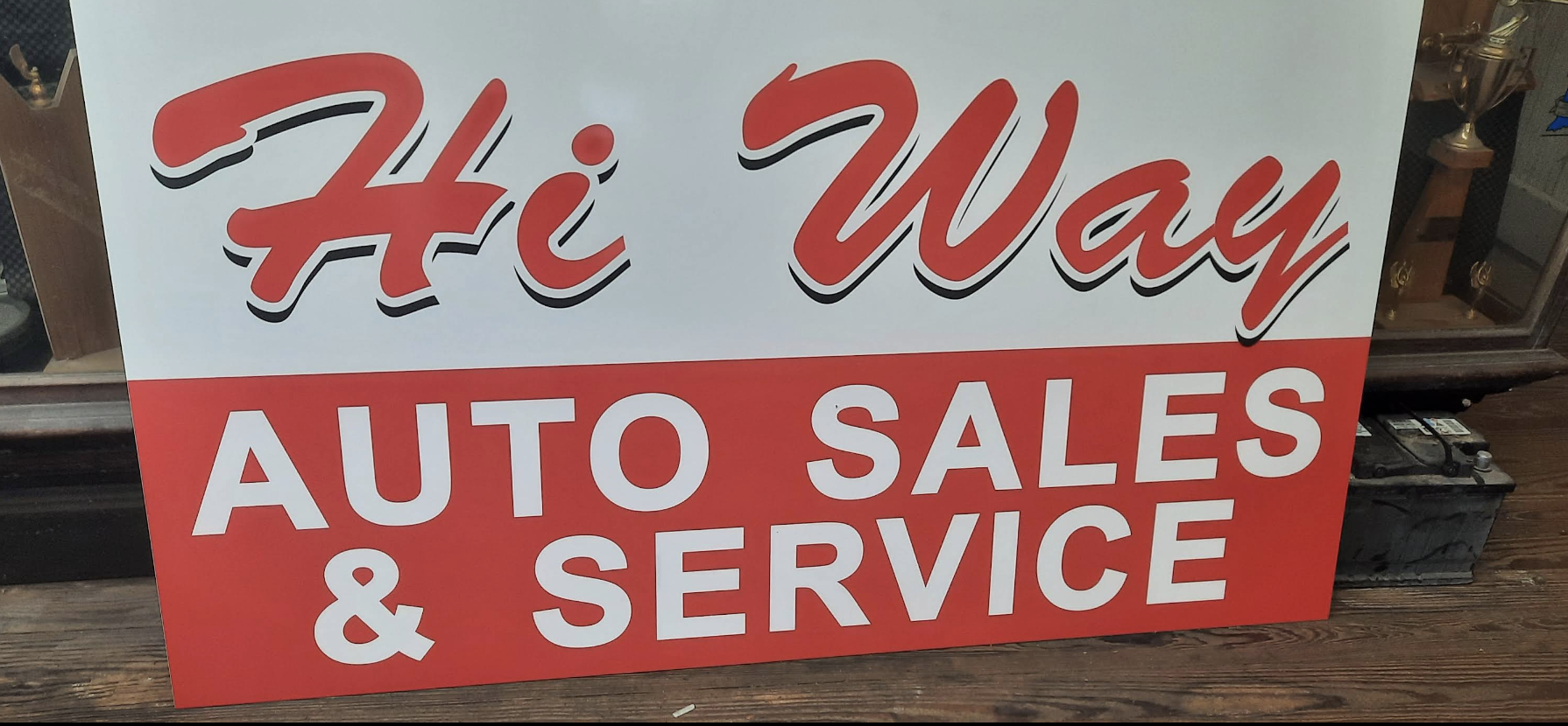 Hi-Way Services storefront sign closeup
